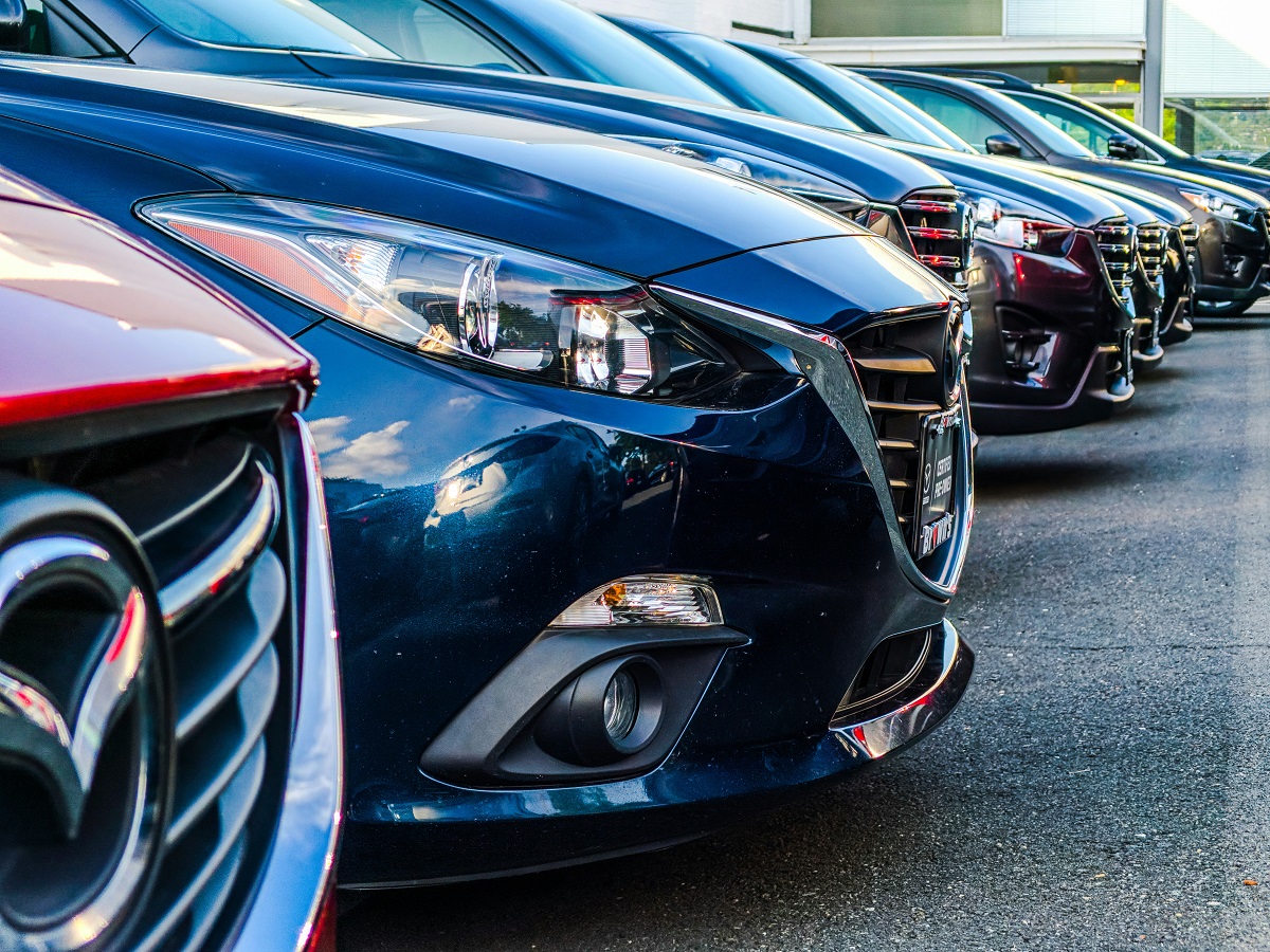 row of cars in a dealership